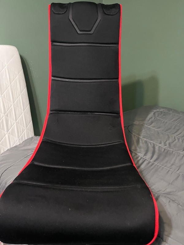 Red and black rocking gaming chair with built in speakers and pockets gallery